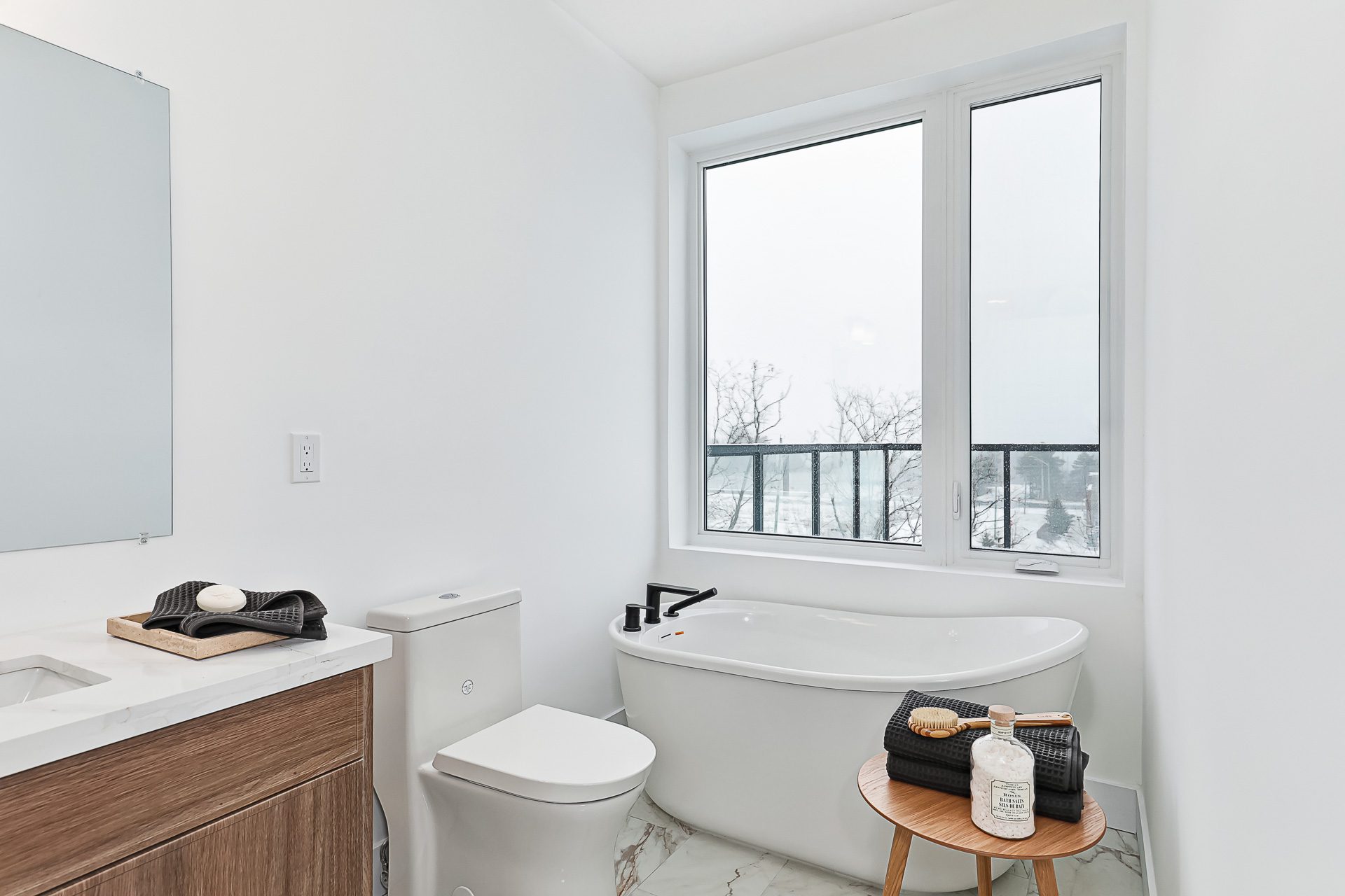 Bathroom with freestanding tub and vanity