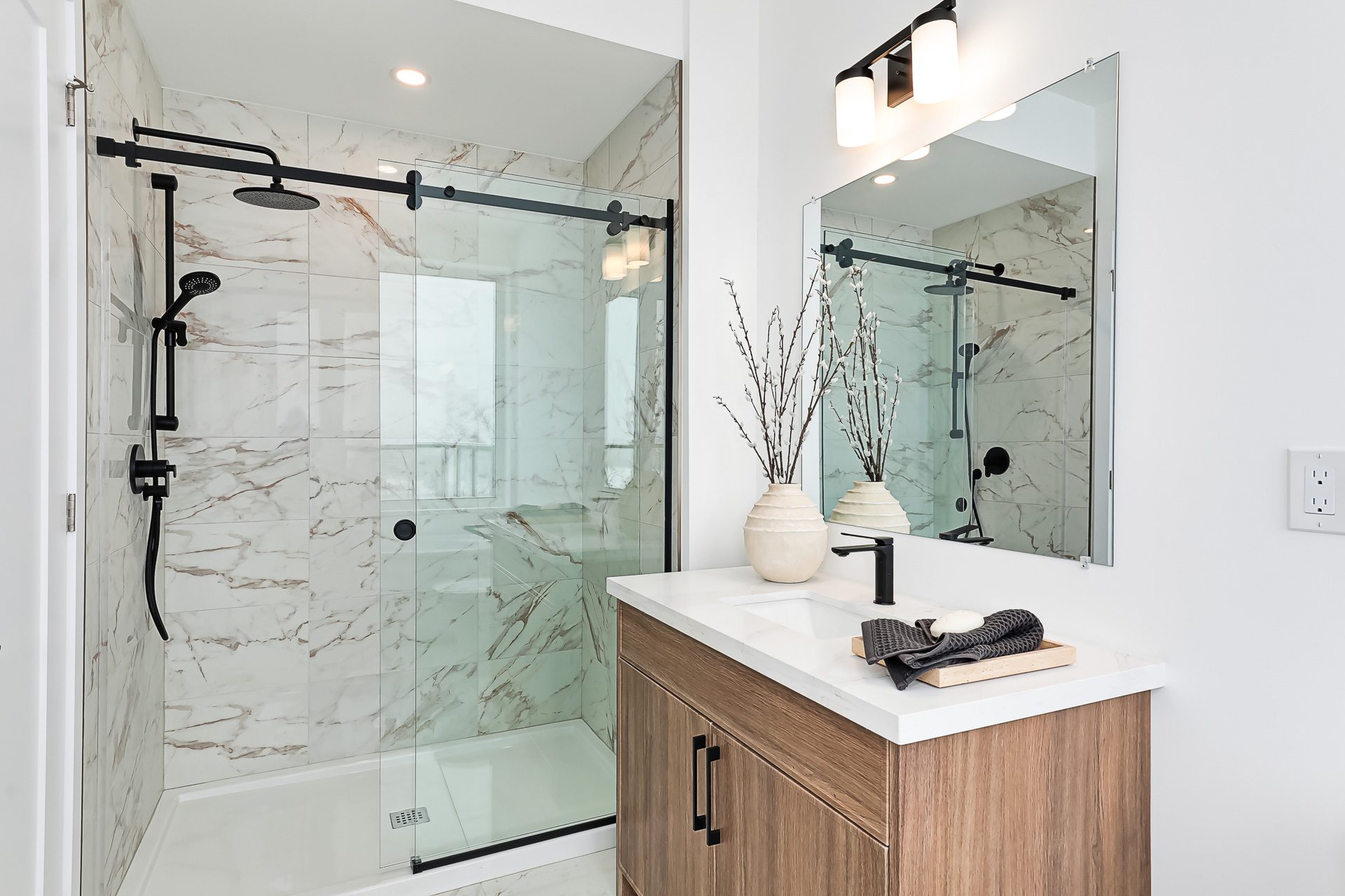 Ensuite with glass shower and marble tile